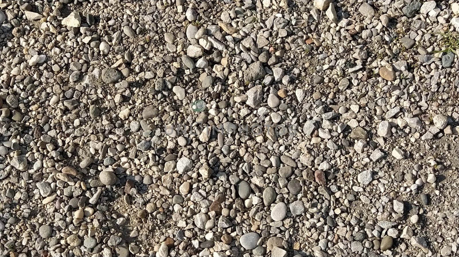 Grey stones background. gray stones. Small and large crushed stone. Natural background
