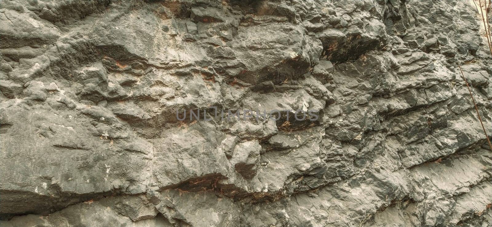 stone rock closeup in Sarajevo, Bosnia and Herzegovina. Layers and layers of ancient rocks. Broken Natural Stone Texture.