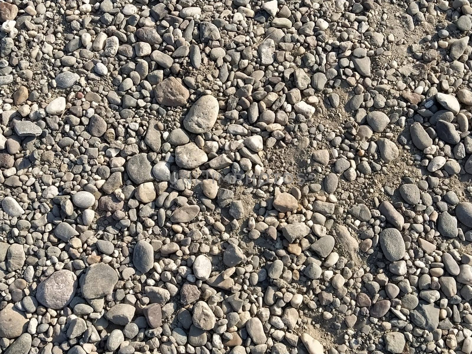 Grey stones background. gray stones. Small and large crushed stone. Natural background