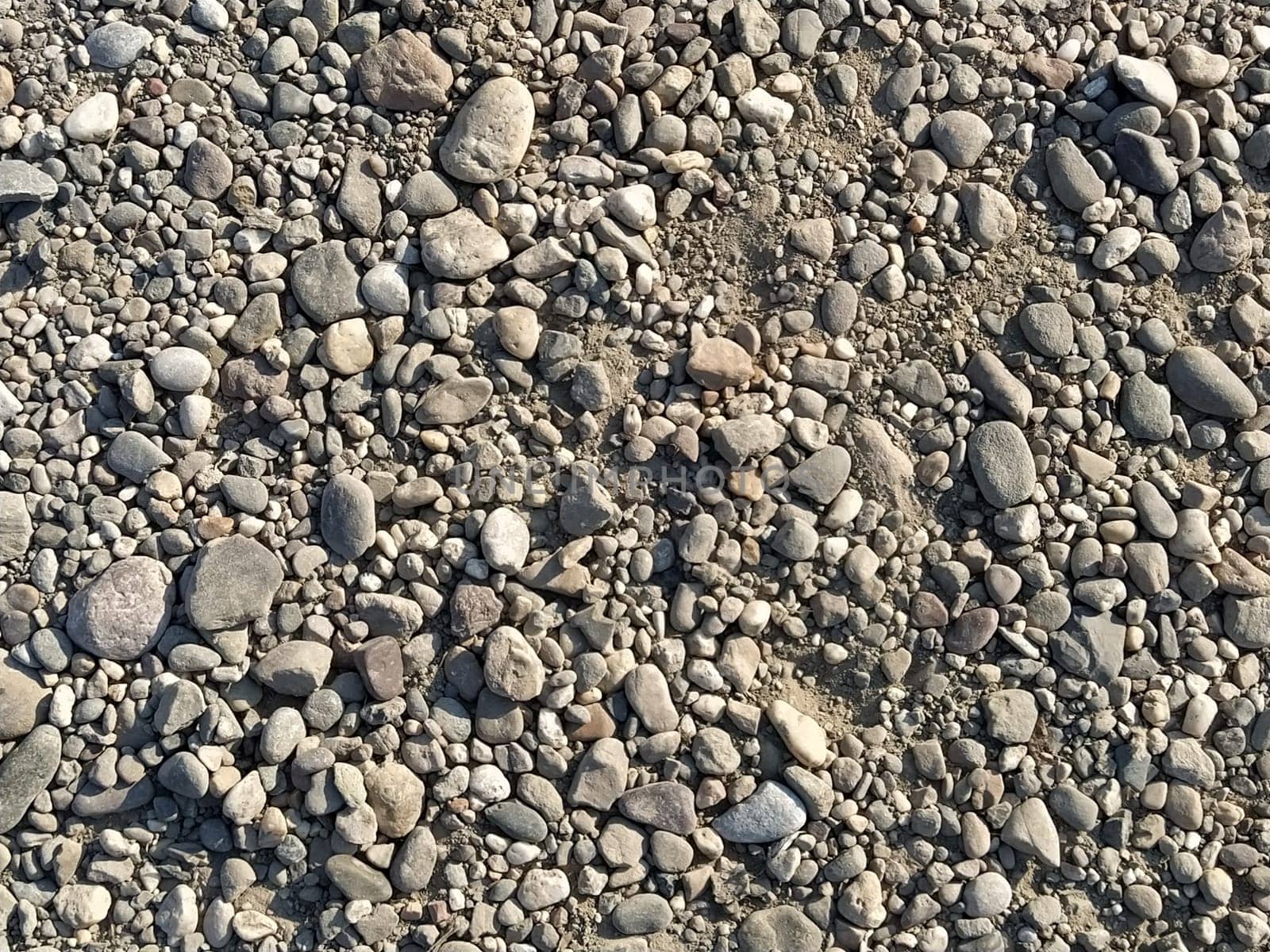 Grey stones background. gray stones. Small and large crushed stone. Natural background.