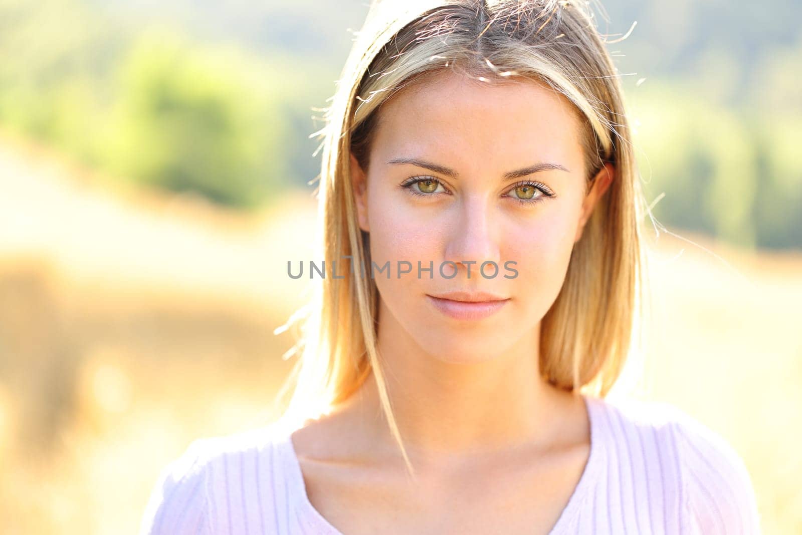 Front view portrait of a beauty portrait of a teen posing in nature