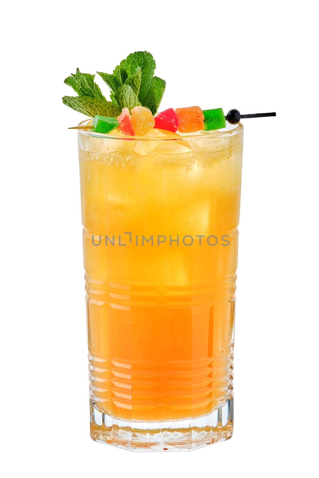 Tall glass of cold mango and passion fruit lemonade isolated on white background