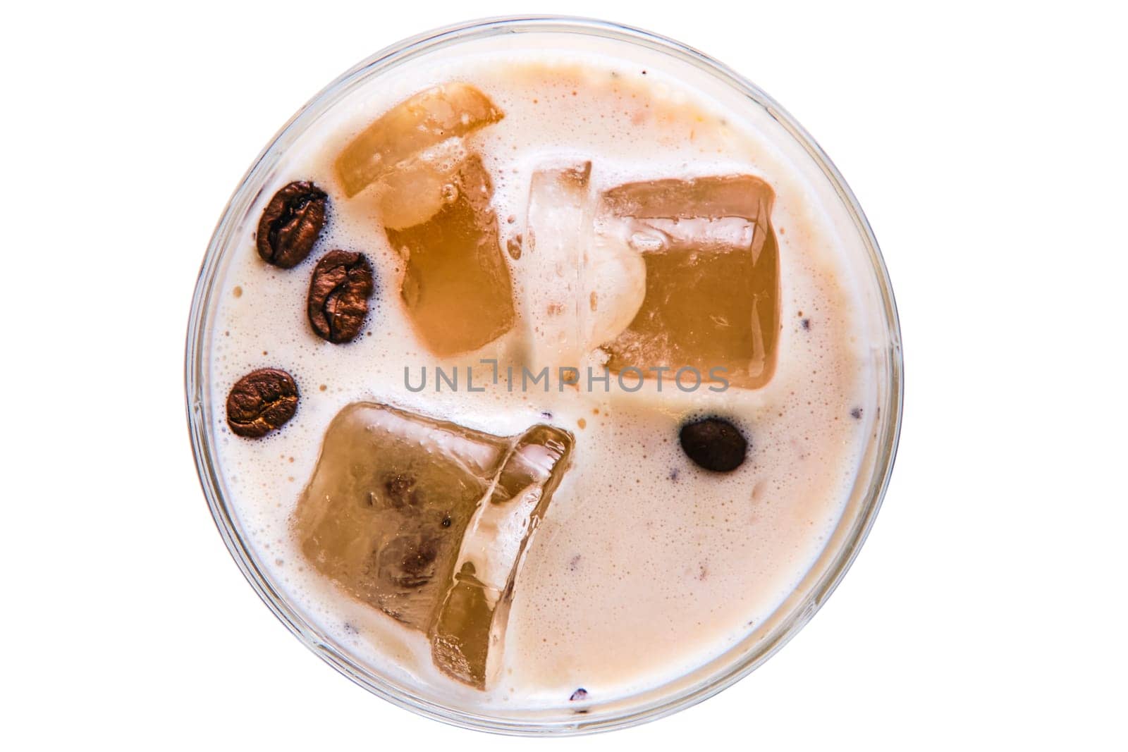 Cocktail white russian in facetted glass, top view