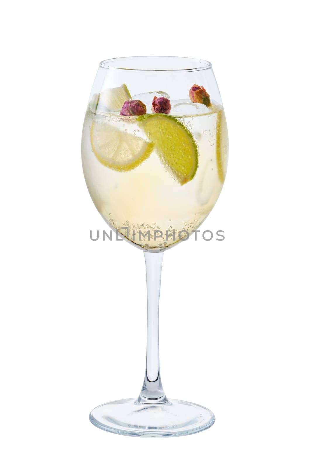 Cold white sangria with dry rosebuds in wine glass isolated on white background
