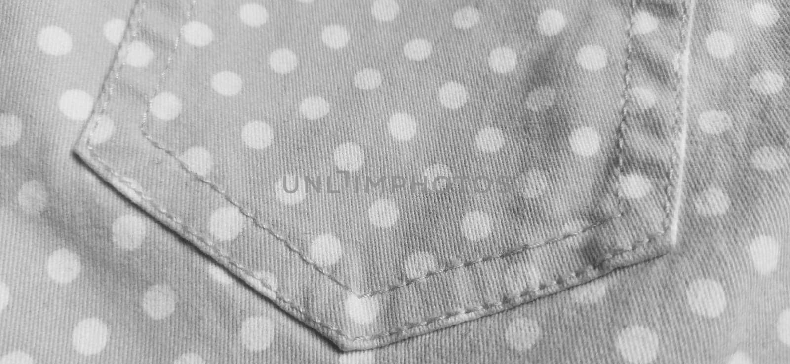 Belgrade, Serbia, 11 September 2020 Trouser pocket. Denim cloth with white circles. Pockets on denim. Polka dot fabric. Black and white monochrome image.