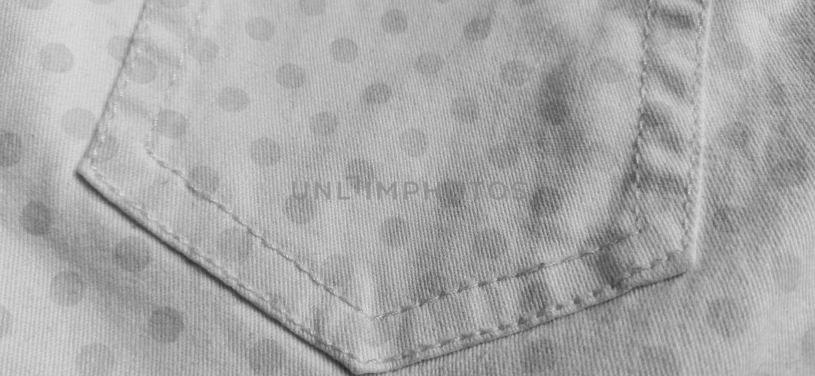Belgrade, Serbia, 11 September 2020 Trouser pocket. Denim cloth with white circles. Pockets on denim. Polka dot fabric. Black and white monochrome image.