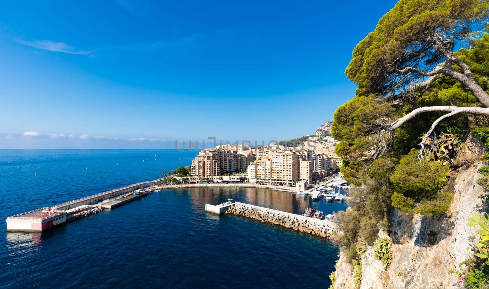 Montecarlo, Monaco - August 2022: panoramic view of the Fontvielle port with blue sky and sea
