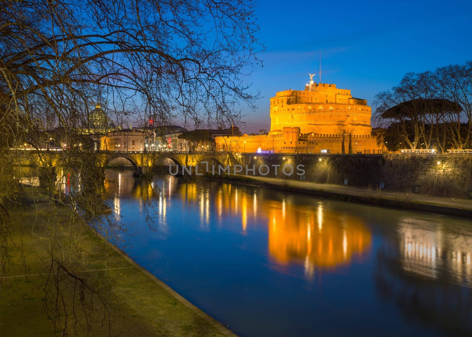 Sant' Angelo Bridge and Basilica of St. Peter at night in Rome, ItalySant' Angelo Bridge and Basilica of St. Peter at night in Rome, Italy