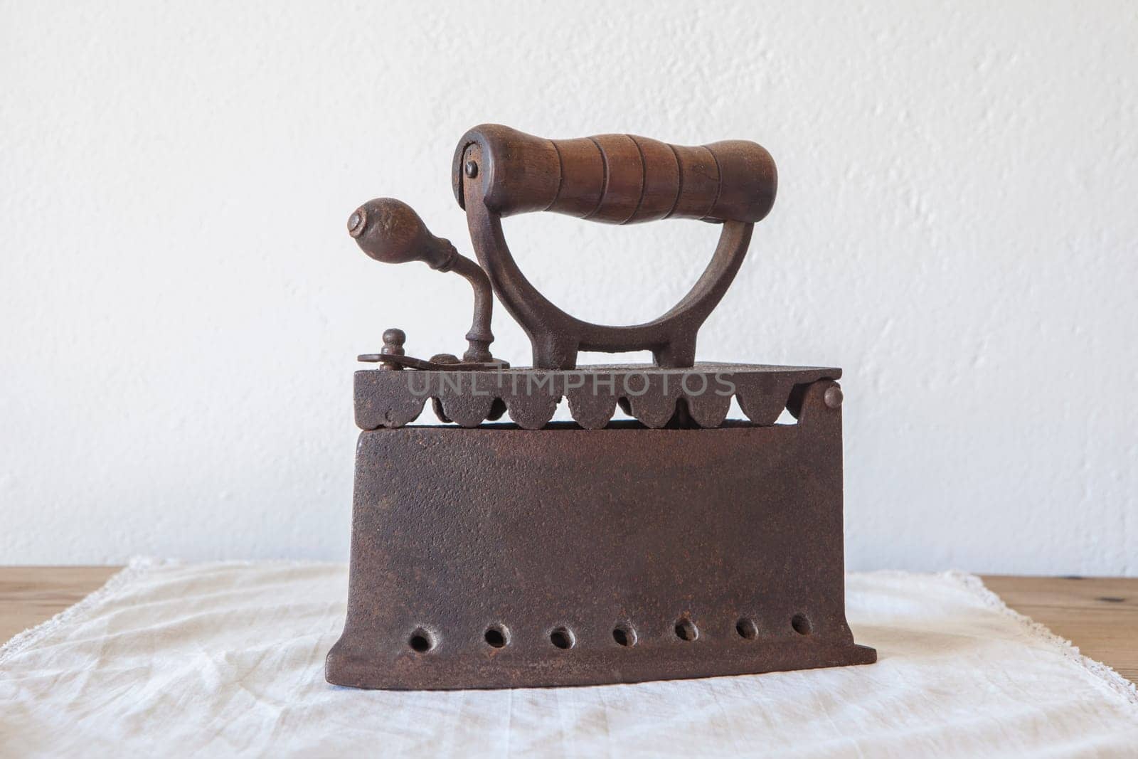 Old rusty charcoal iron. Country style background