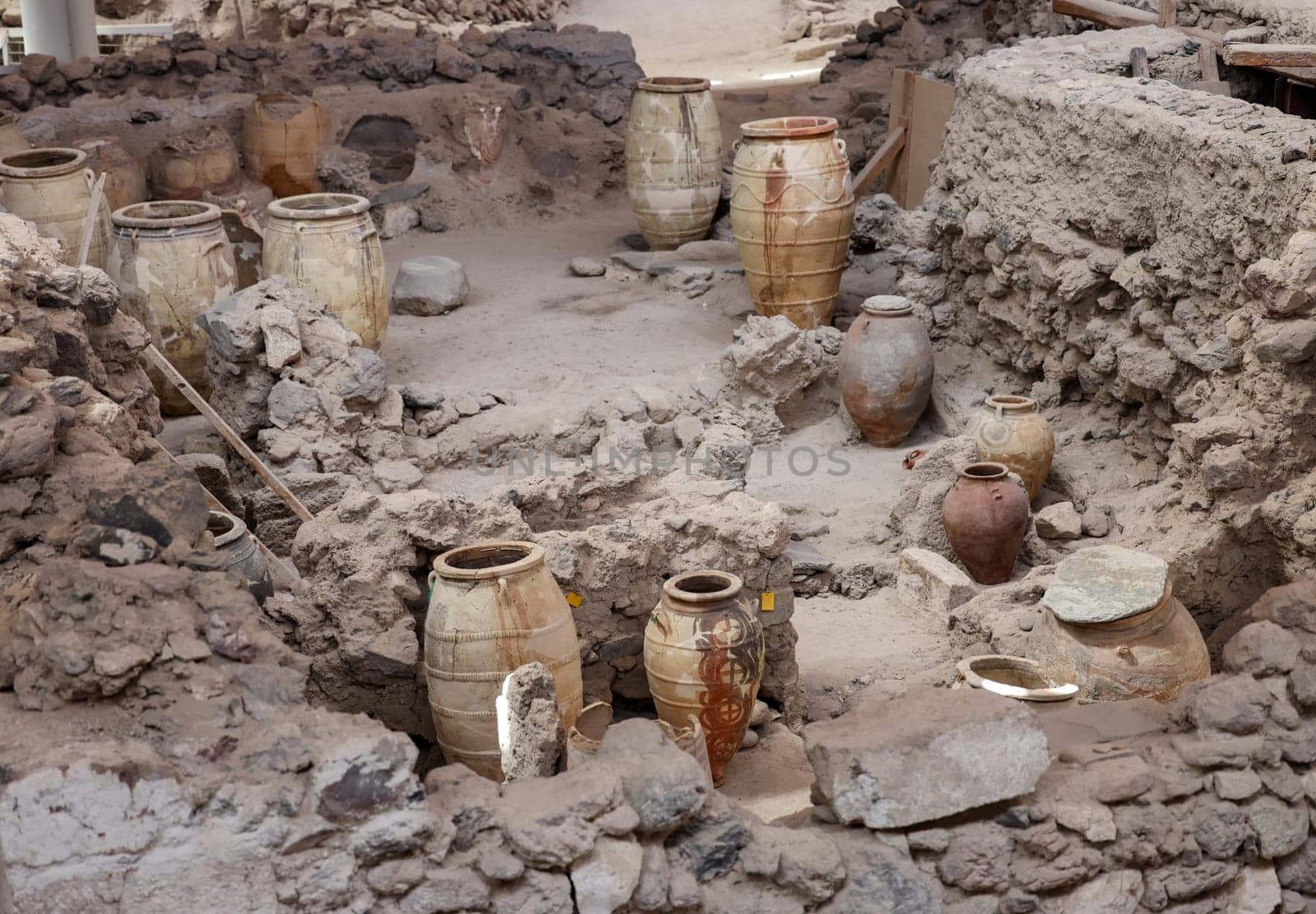 Santorini, Greece - July 01, 2021: Recovered ancient pottery in prehistoric town of Akrotiri, excavation site of a Minoan Bronze Age settlement on the Greek island of Santorini