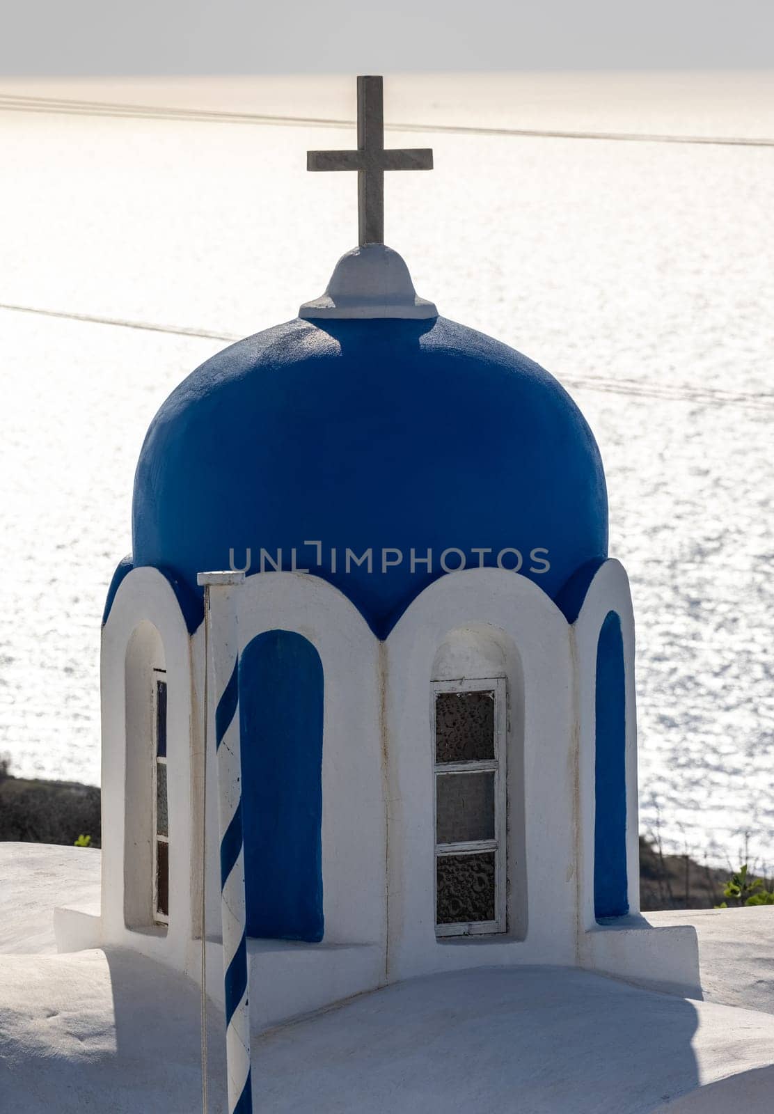 Blue dome of  greek orthodox Christian church in Oia. Santorini, Greece