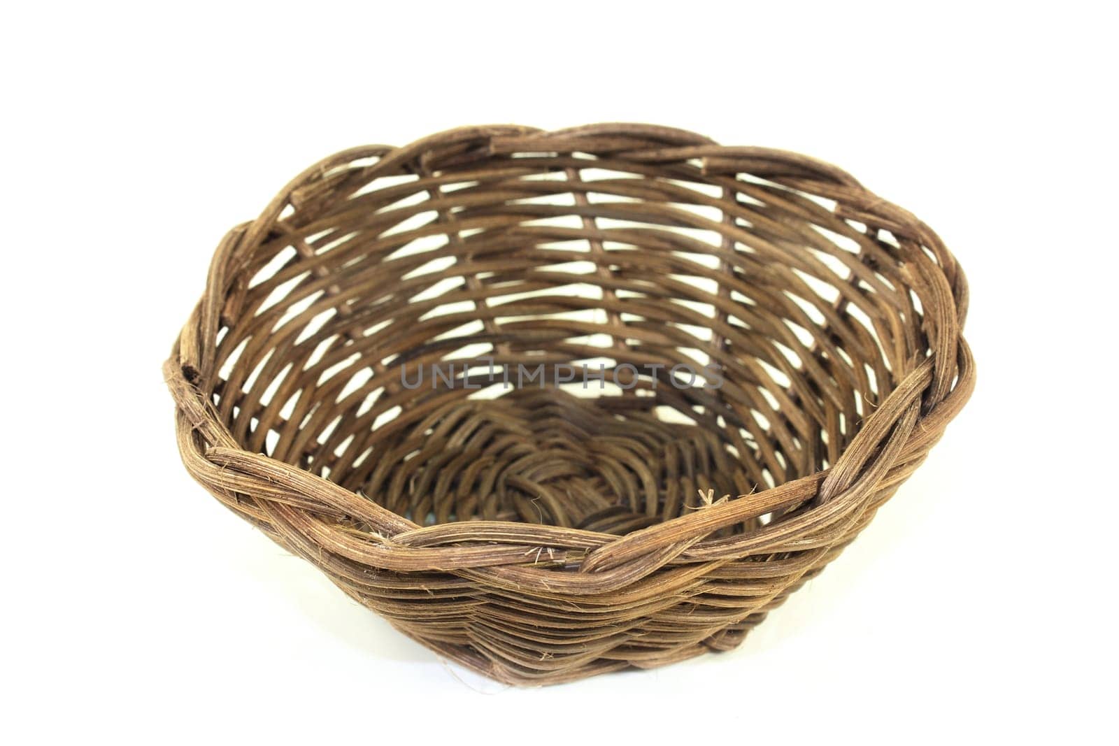 braided willow basket against a bright background