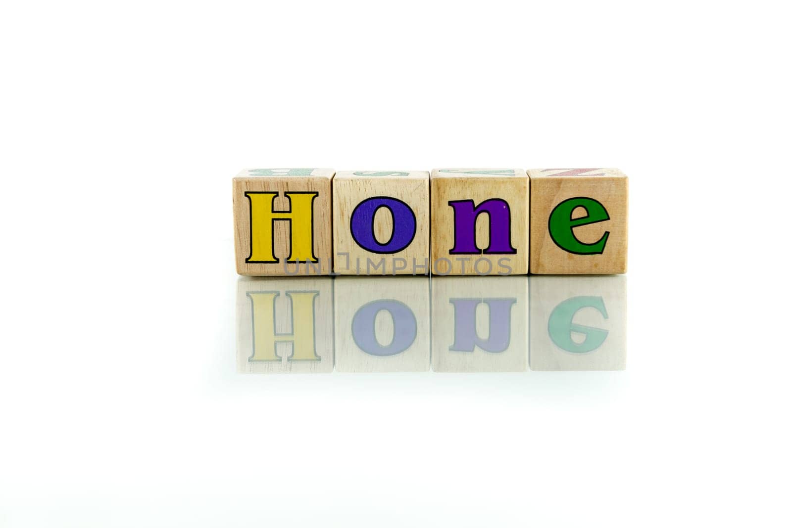 hone colorful wooden word block on the white background