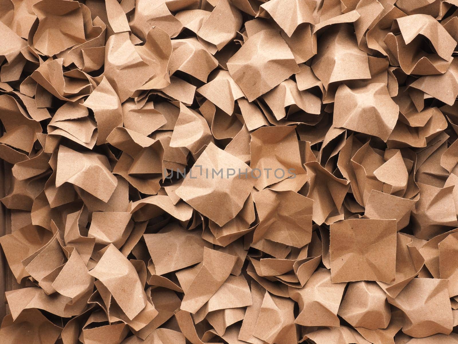 Eco friendly packaging material made of recycled waste paper to protect the goods against damage using as background or header, environmental protection, reuse materials