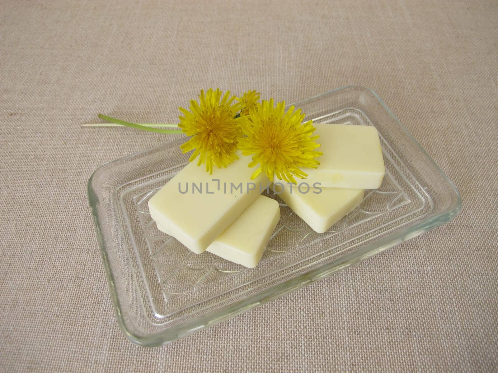 Homemade solid body butter with dandelion oil, cocoa butter, coconut oil