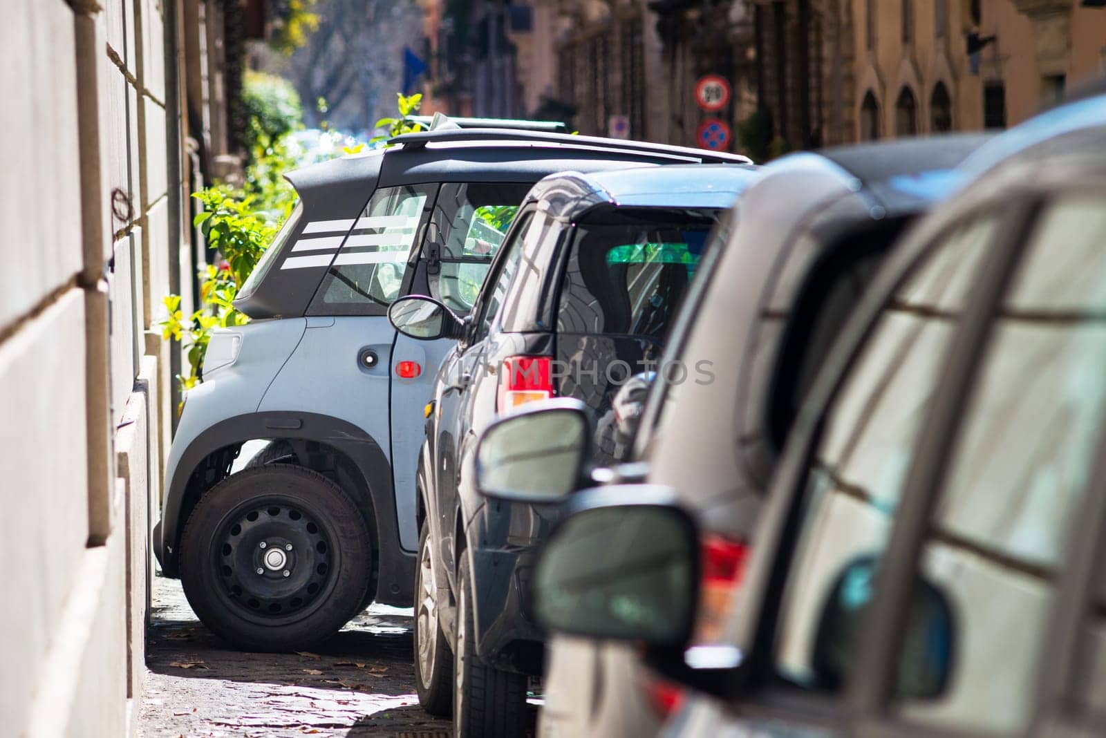 A small car park across in a parking space in the city of rome
