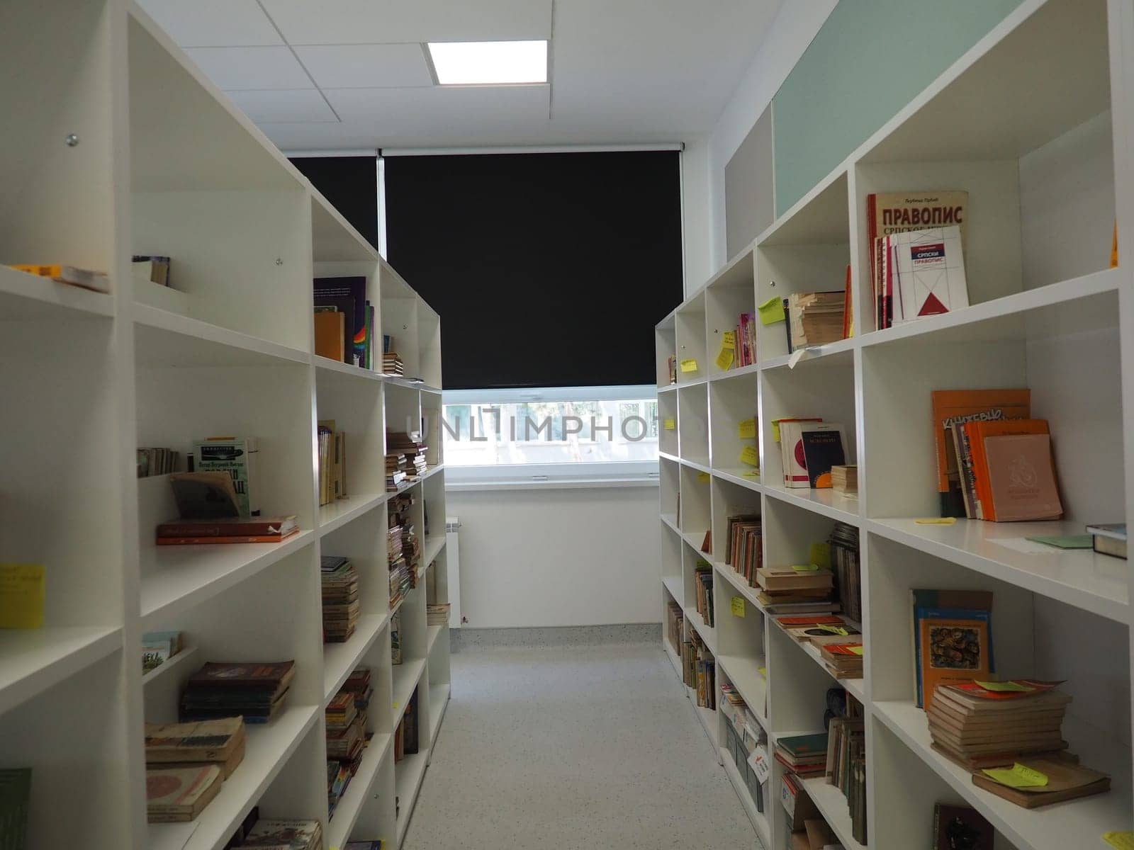 Sremska Mitrovica, Serbia, May 15, 2021 Interior of the school library. Modern school equipment. Equipment of the school and the learning process. Bookshelves. Blackout curtains and blinds on windows