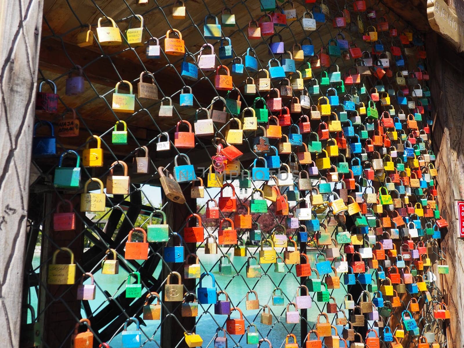 Stanisici, Bijelina, Bosnia and Herzegovina. April 25, 2021 Locks of love on a metal mesh. Many colorful beautiful castles were left by young wives and lovers. Locks hang from the fence.