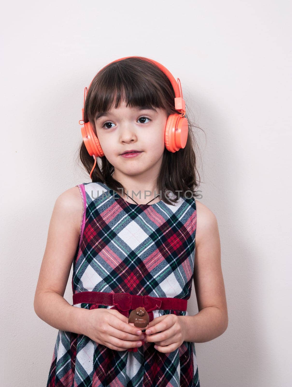 Little girl using the earphones