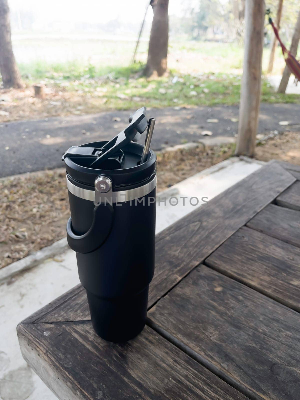 Reusable steel thermal water cup, stock photo