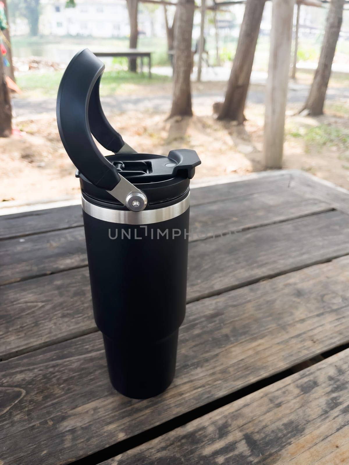 Reusable steel thermal water cup, stock photo