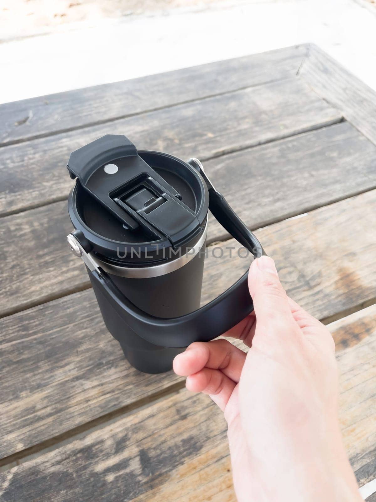 Reusable steel thermal water cup, stock photo