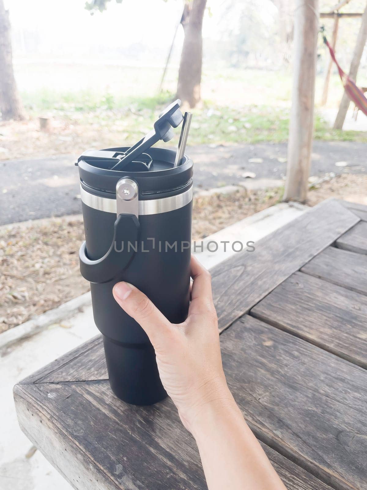 Reusable steel thermal water cup, stock photo