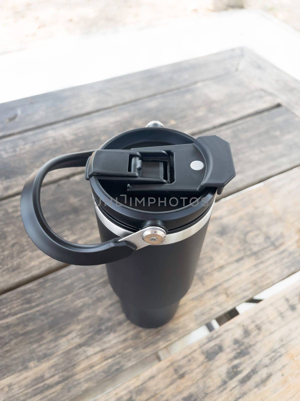 Reusable steel thermal water cup, stock photo