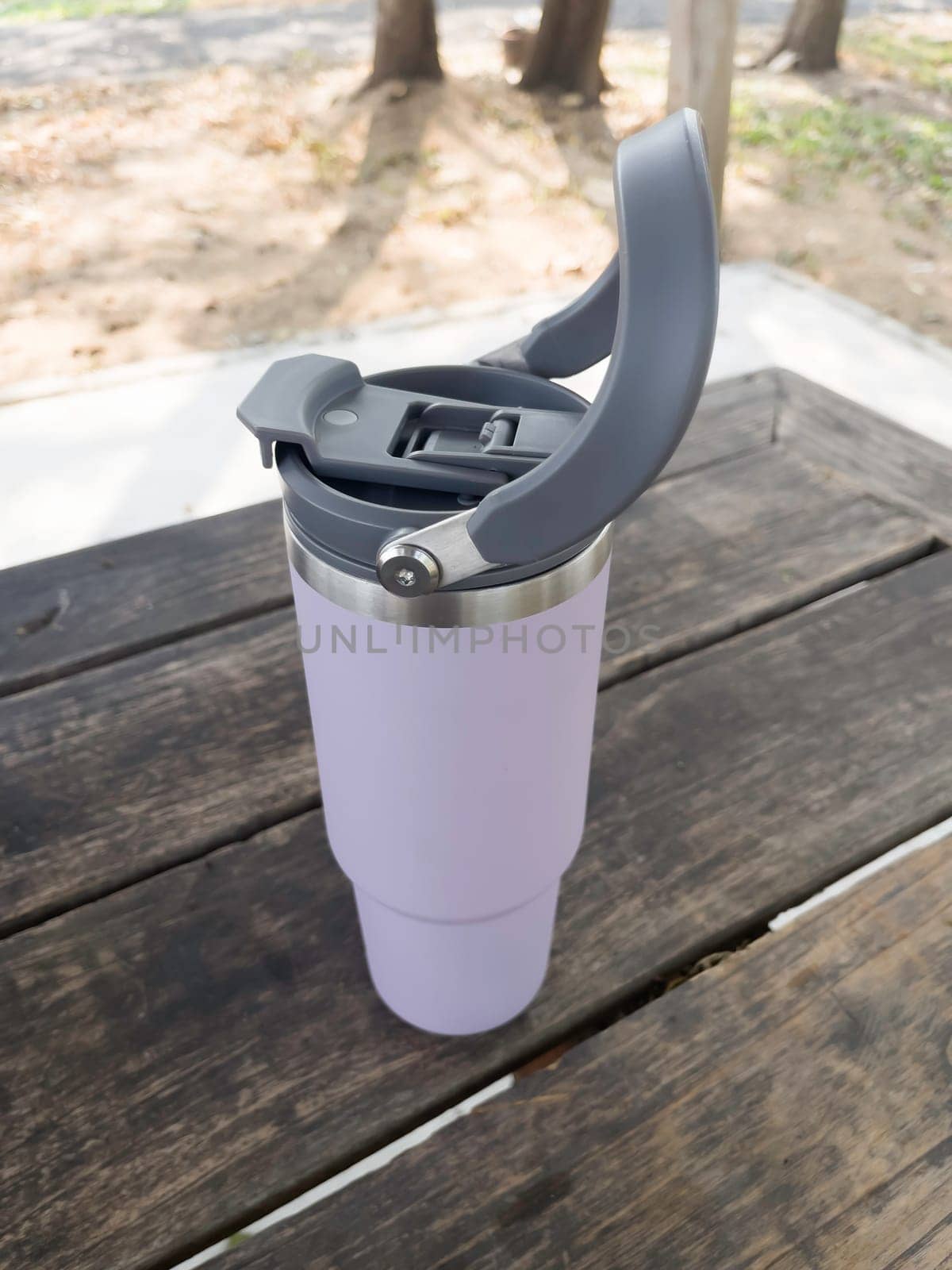 Reusable steel thermal water cup, stock photo