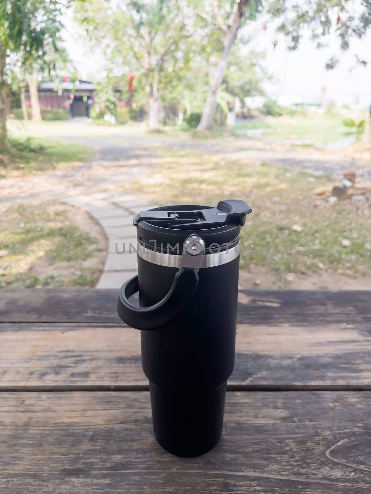 Reusable steel thermal water cup, stock photo