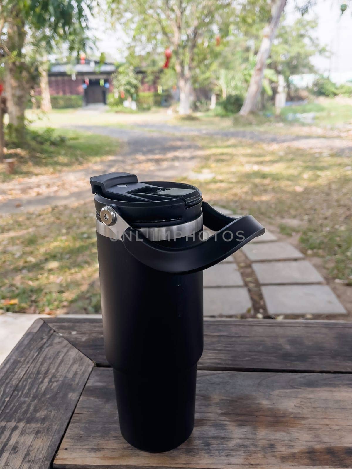 Reusable steel thermal water cup, stock photo