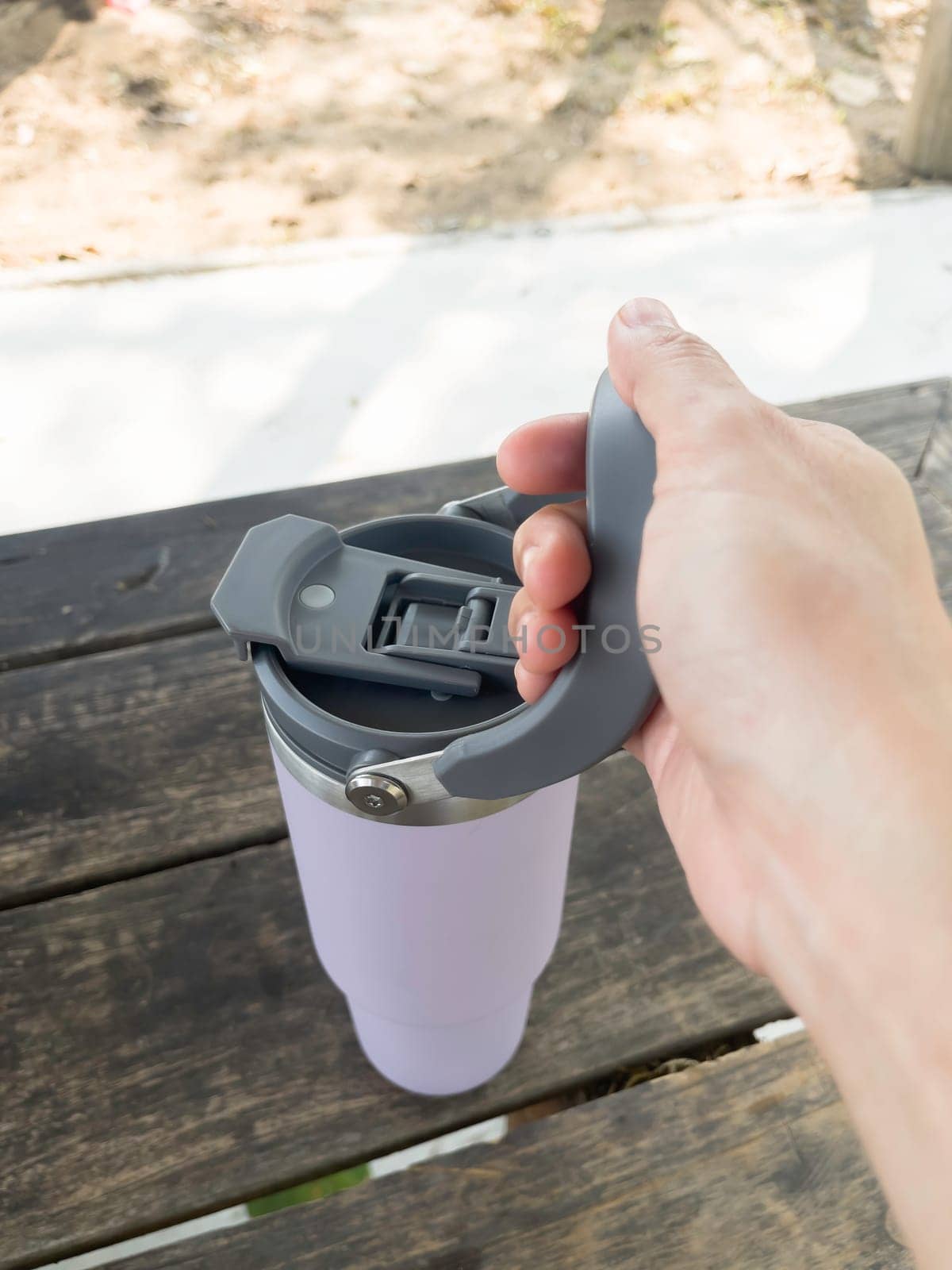 Reusable steel thermal water cup, stock photo