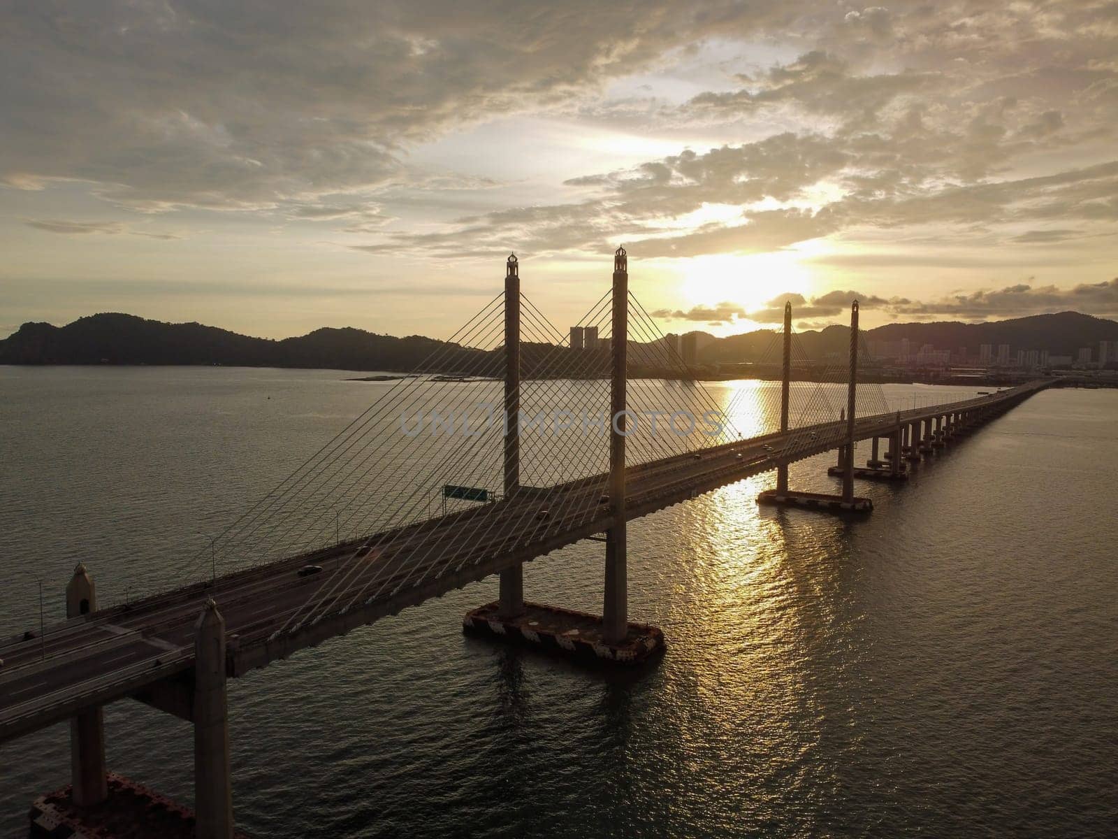 Aerial view silhouette Penang Second Bridge during sunset