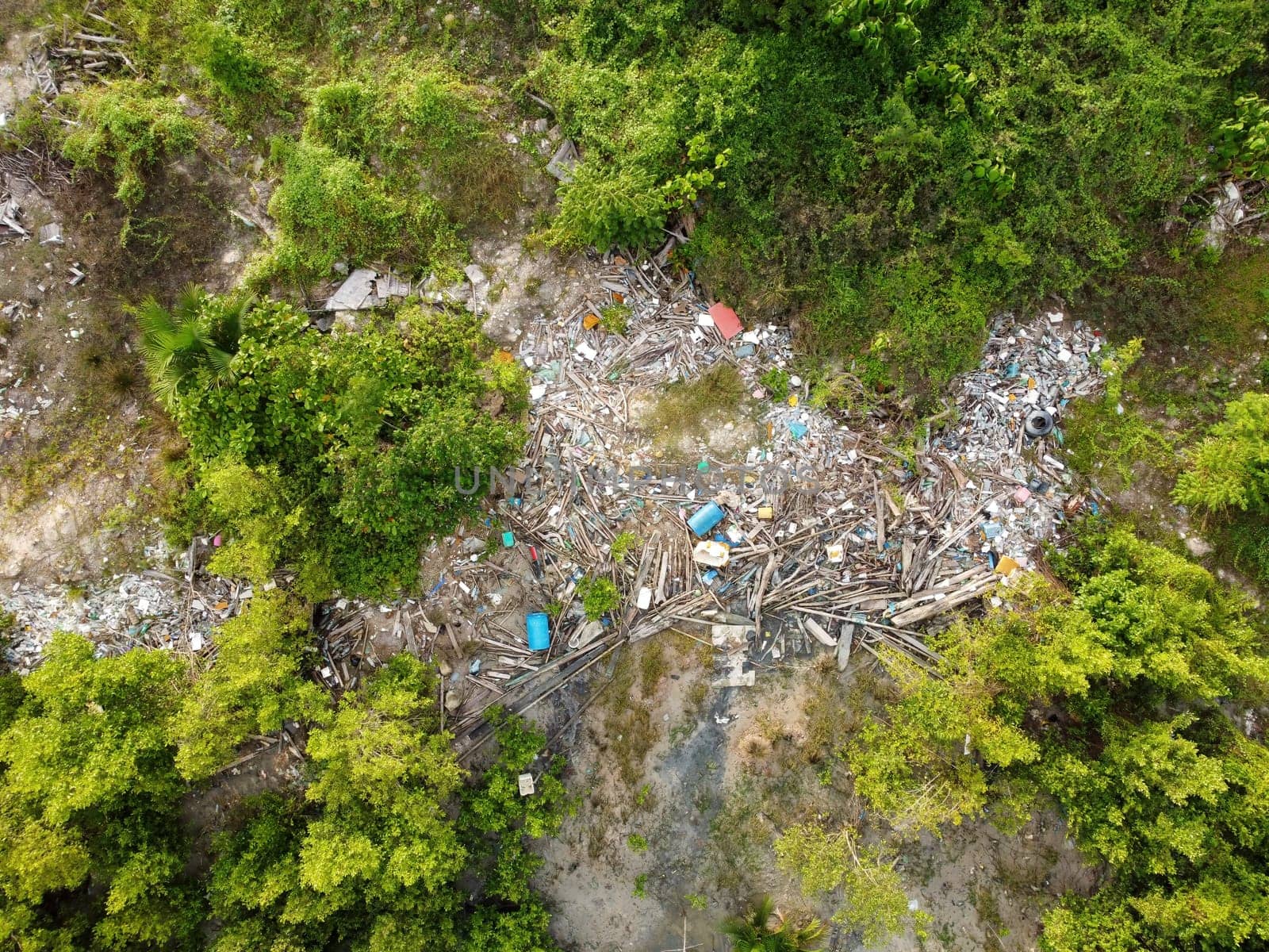 Aerial top down view the rubbish is trapped coastal after high tide
