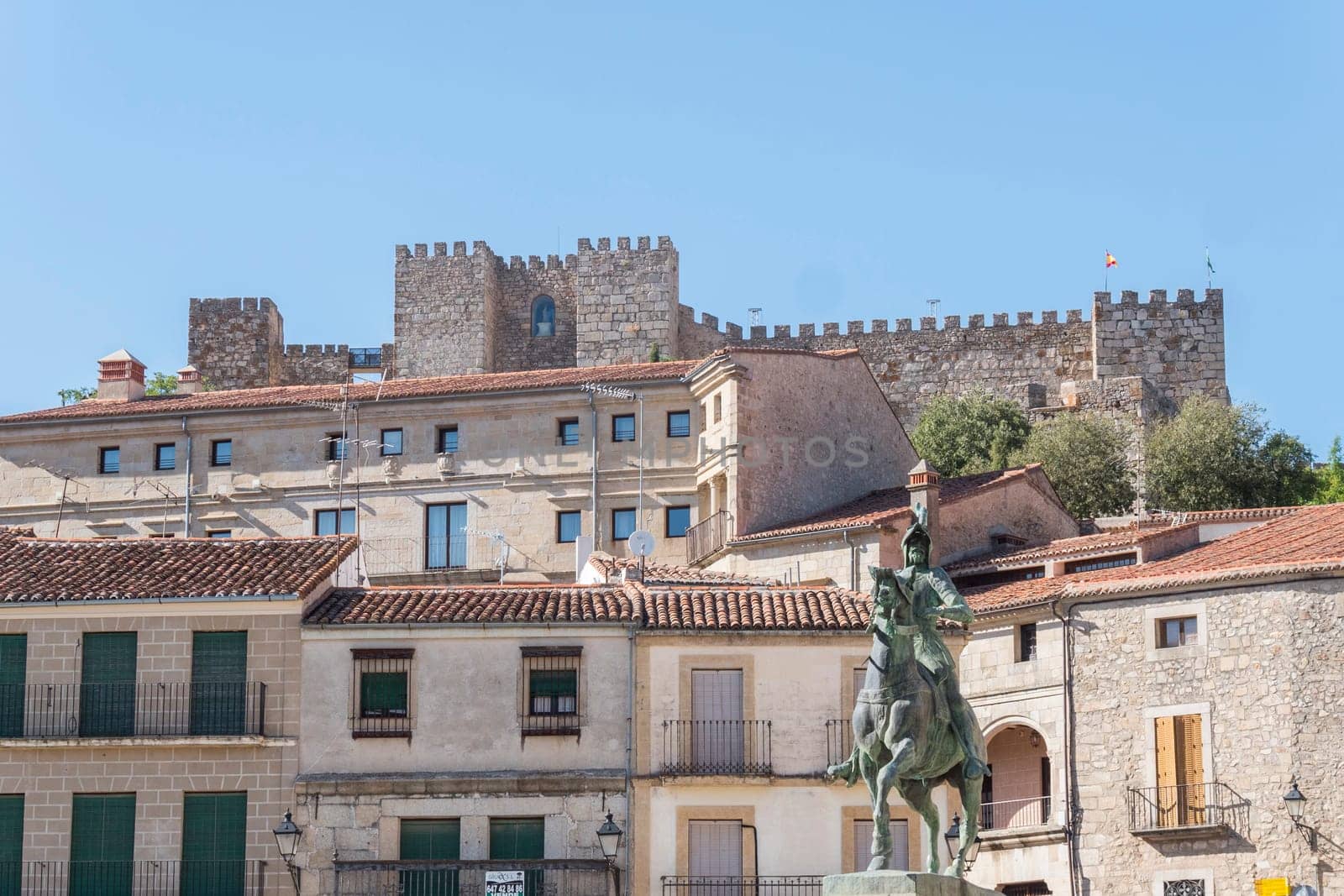 Panoramic view from Trujillo main square. Statue of Francisco Pisarro and Castle (Trujillo, Caceres, Spain).