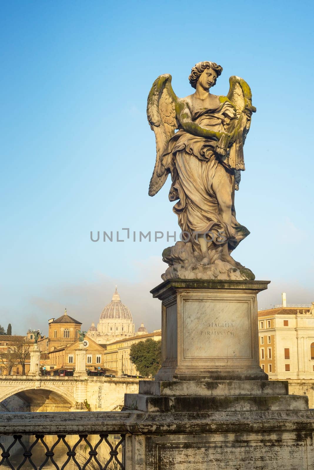 Beautiful angel with Cross in the Bridge of Saint Angelo Castle, Rome