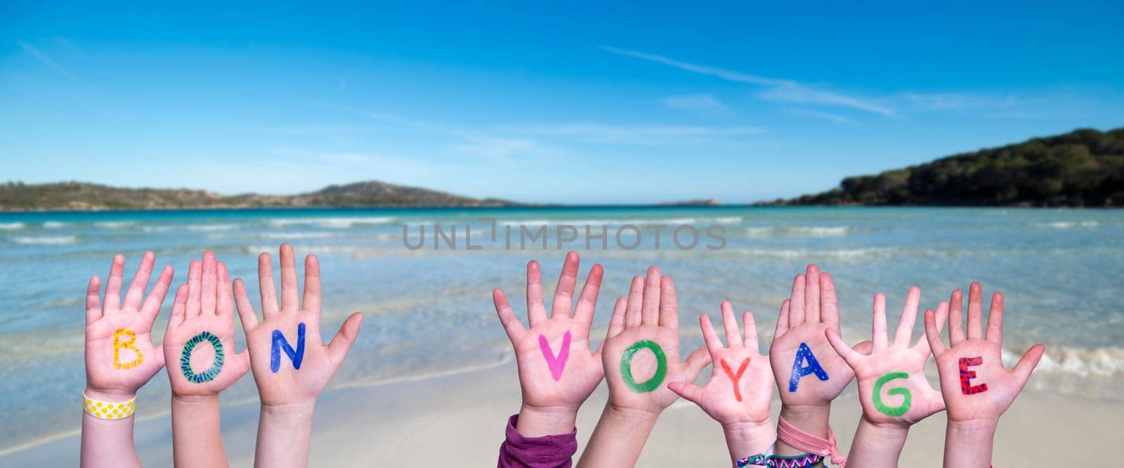 Children Hands Building Colorful French Word Bon Voyage Means Have A Good Trip. Summer Ocean, Sea And Beach As Background