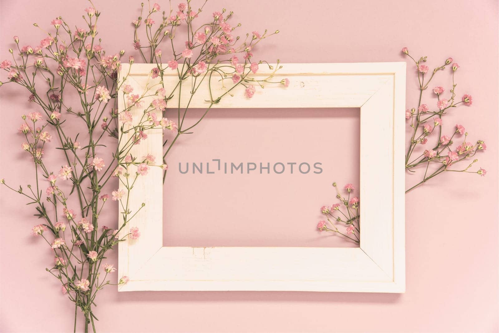 Vintage Photo Frame With Ikebana Flower Arrangement With Copy Space For Free Text. Retro Pastel Background