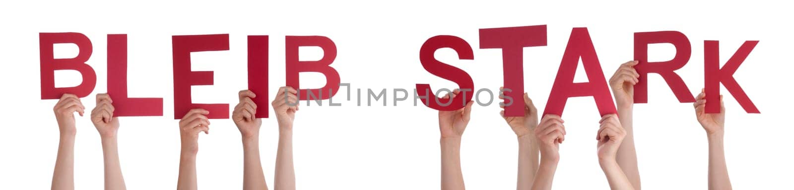 People Or Persons Hands Building German Word Bleib Stark Means Be Strong. Isolated White Background.