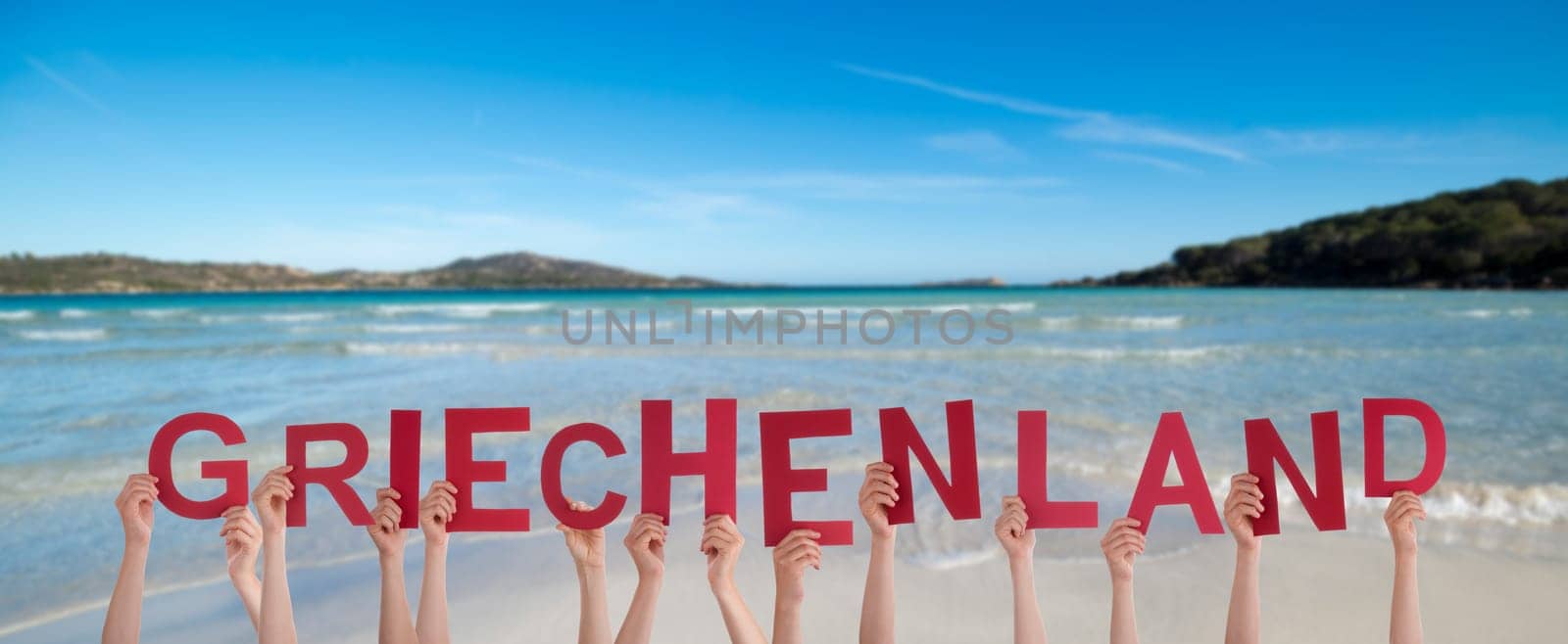 People Or Persons Hands Building German Word Griechenland Means Greece. Summer Ocean, Sea And Beach As Background.