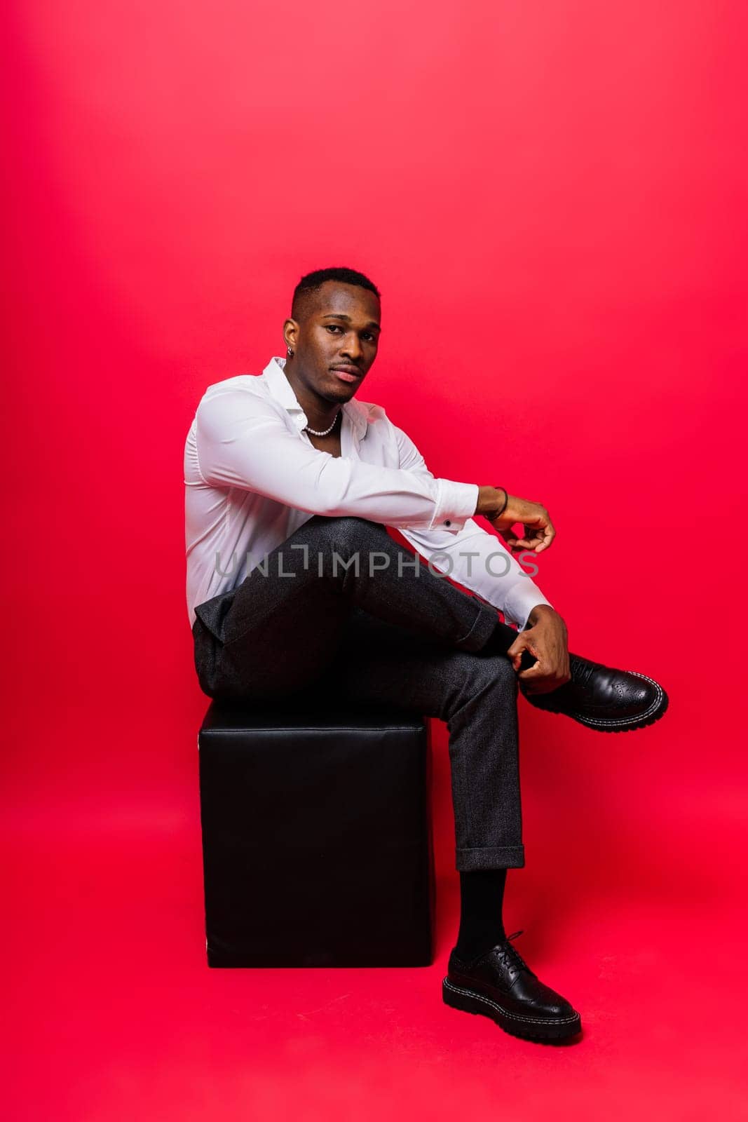 Happy african american young businessman in a formal suit. Smiling confident black guy