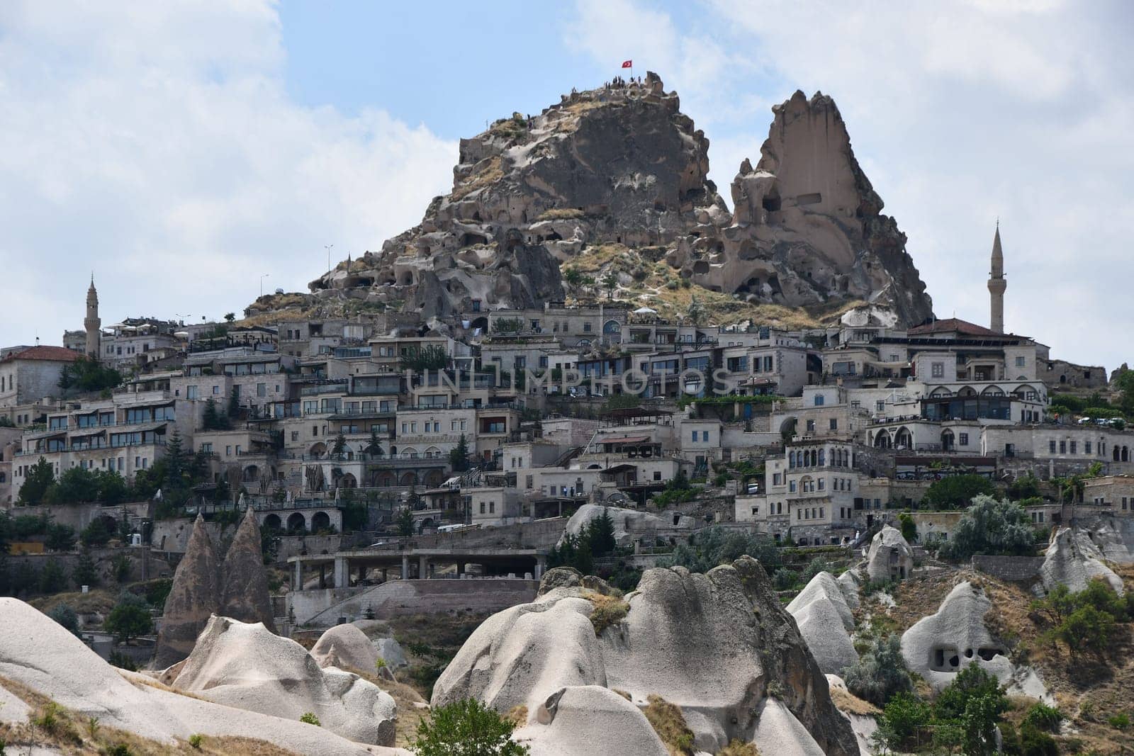 Houses on the mountainside and the Uchisar Castle in Uchisar, Cappadocia, Turkey
