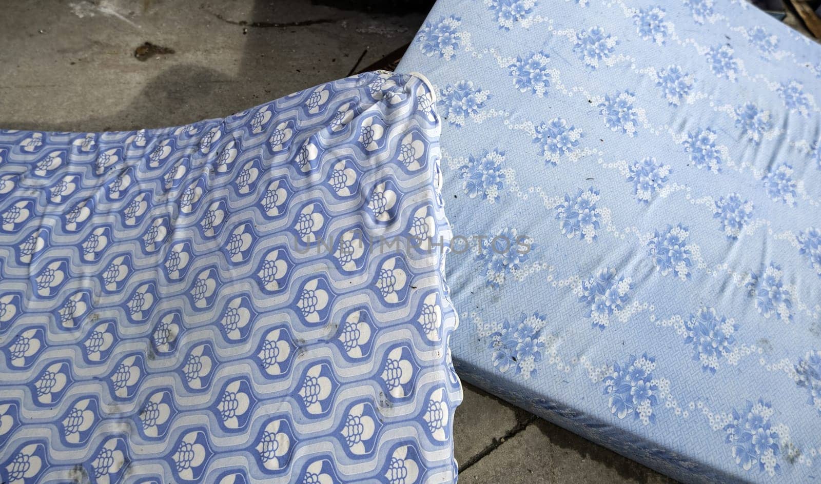 Detail of old dirty and damaged mattresses, recycling