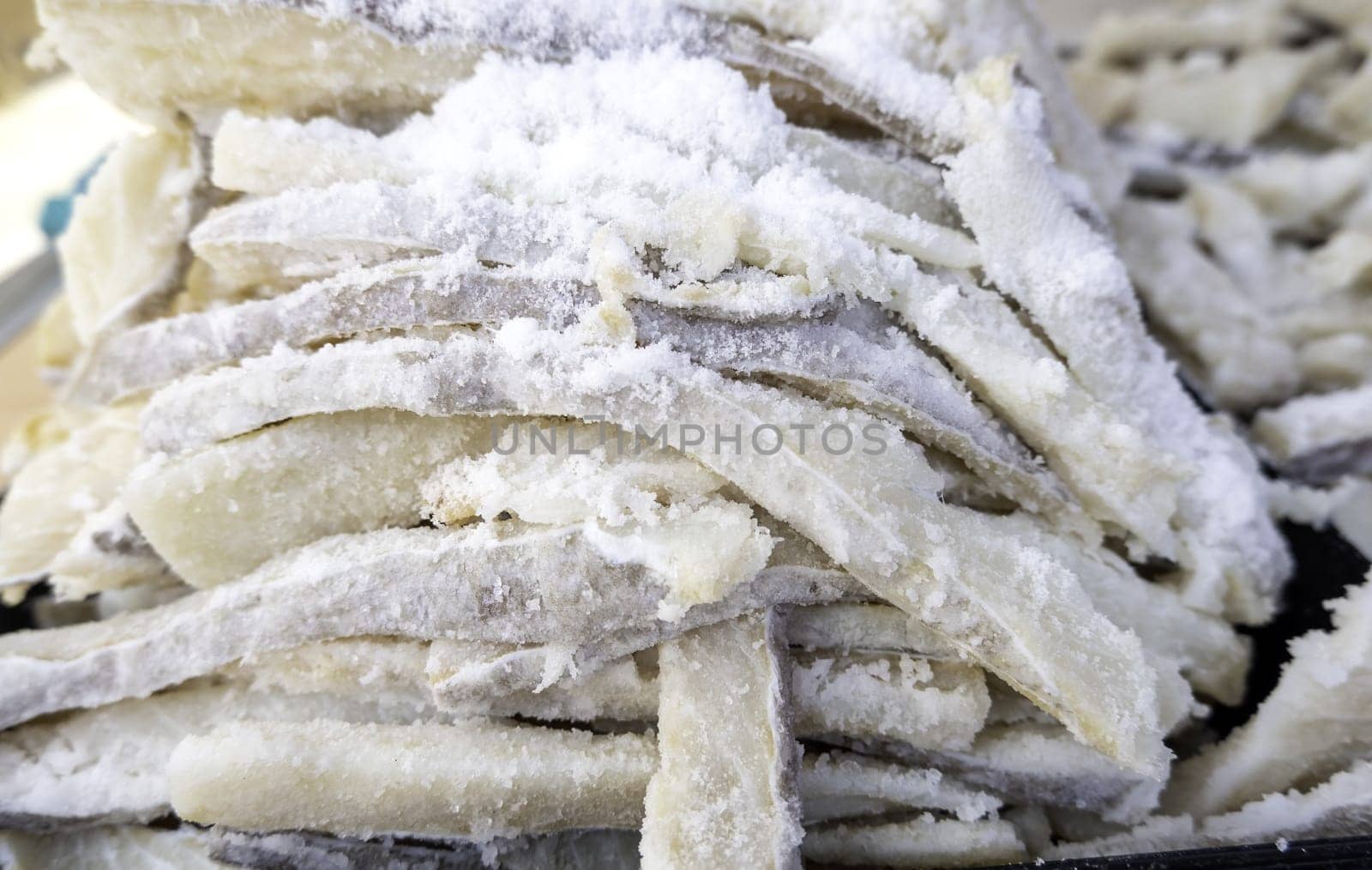 Detail of dried fish with salt in a market, healthy food