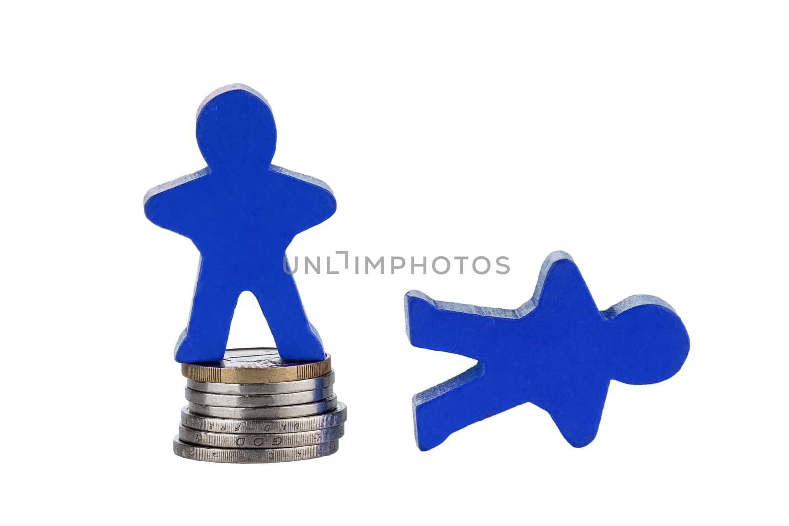 Wooden human figure on stack of coins for business concept