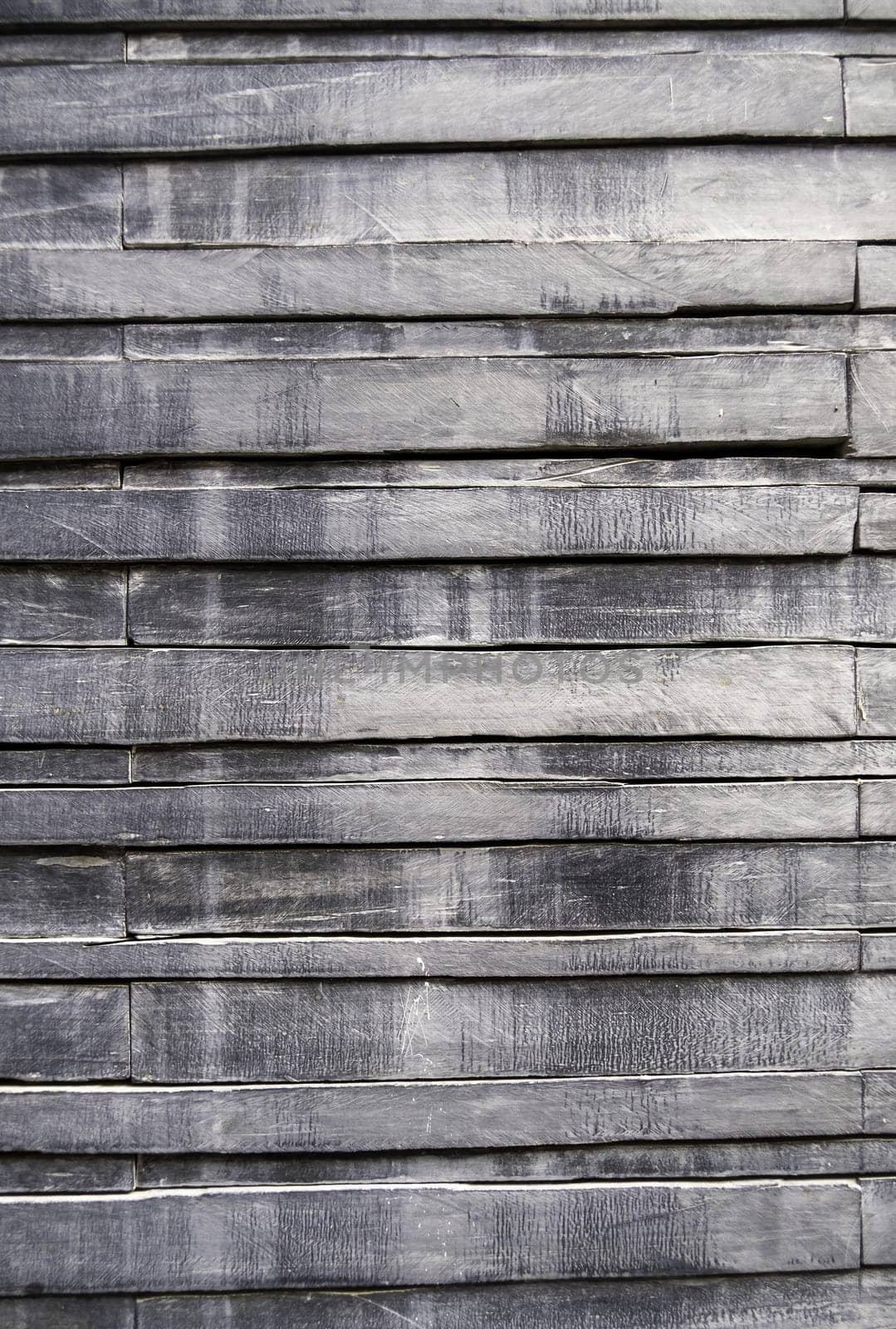 Detail of gray wooden wall in a facade, decoration