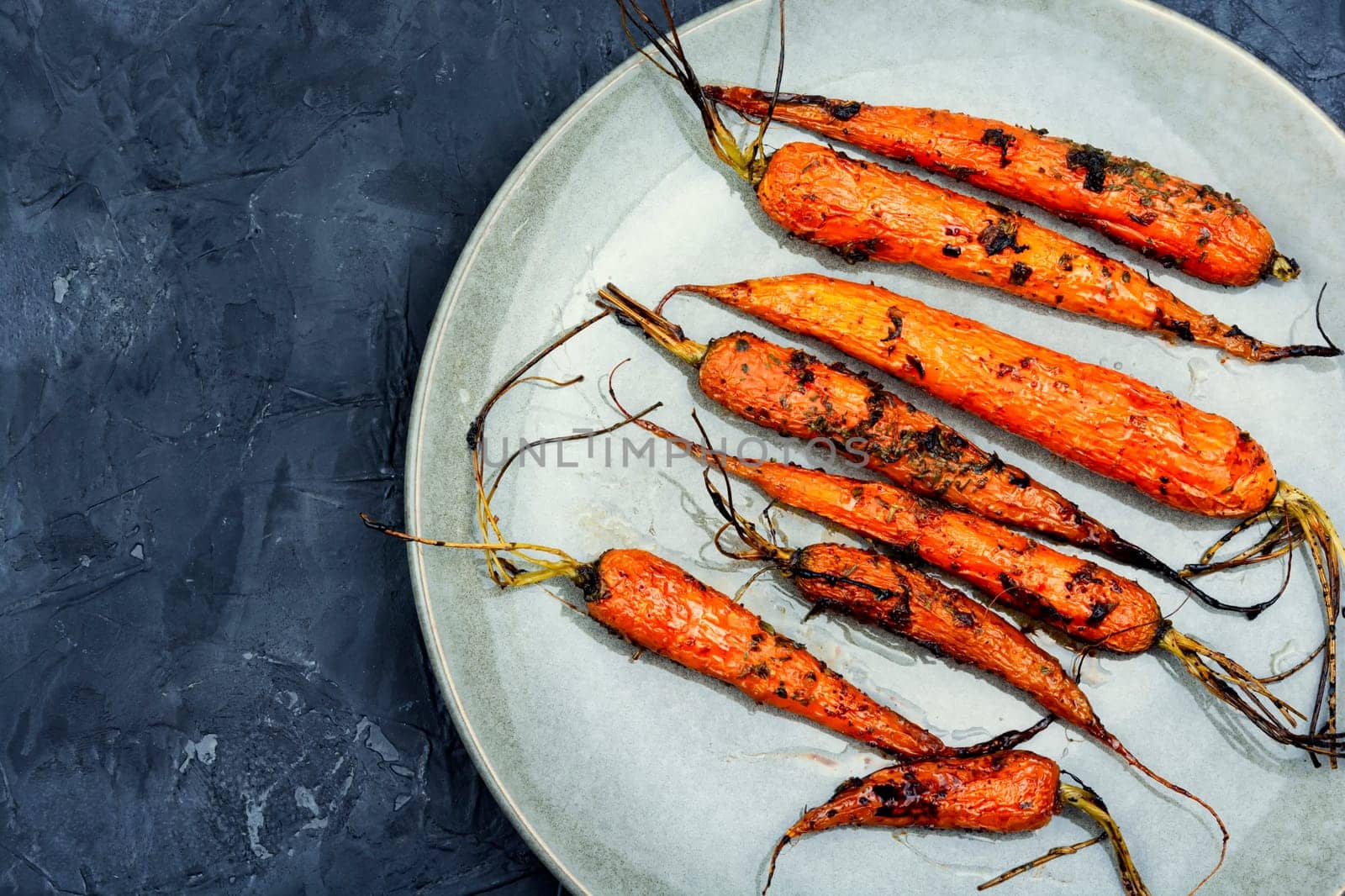 Baked carrots in a ceramic form. Top view