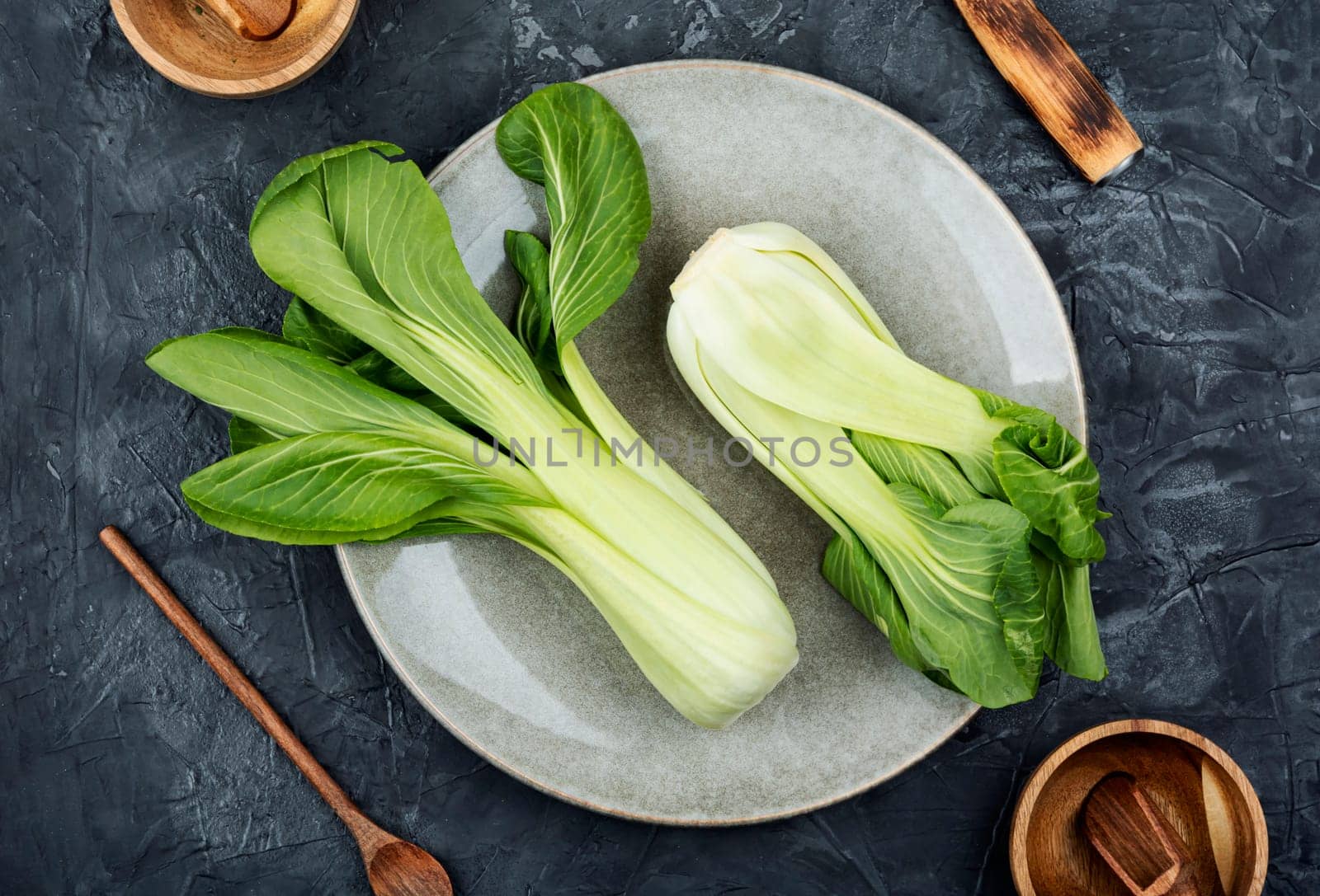 Fresh bok choy or chinese cabbage on the kitchen table