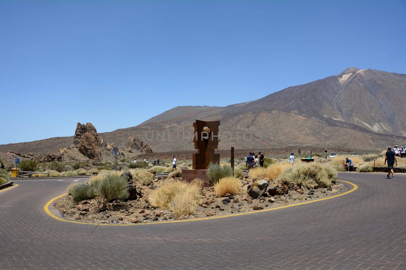 Teide National Park, Tenerife, Spain August 13, 2022 - Parking lot with sculpture at the Parador de Cañadas del Teide excursion restaurant and hotel at Roques de García in the national park overlooking Mount Teide on the Canary Island of Tenerife