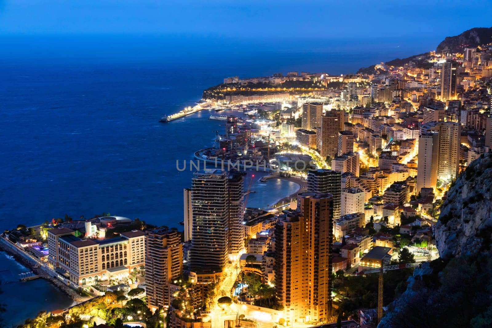 Monte Carlo panorama illuminated by night. Urban landscape with luxury architecture